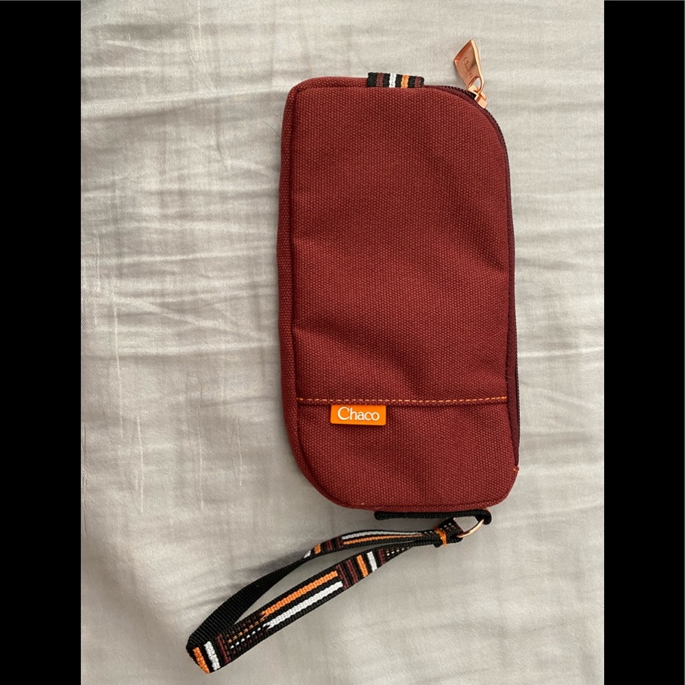 Chaco wristlet wallet Rust red color with Rose gold hardware. Perfect condition